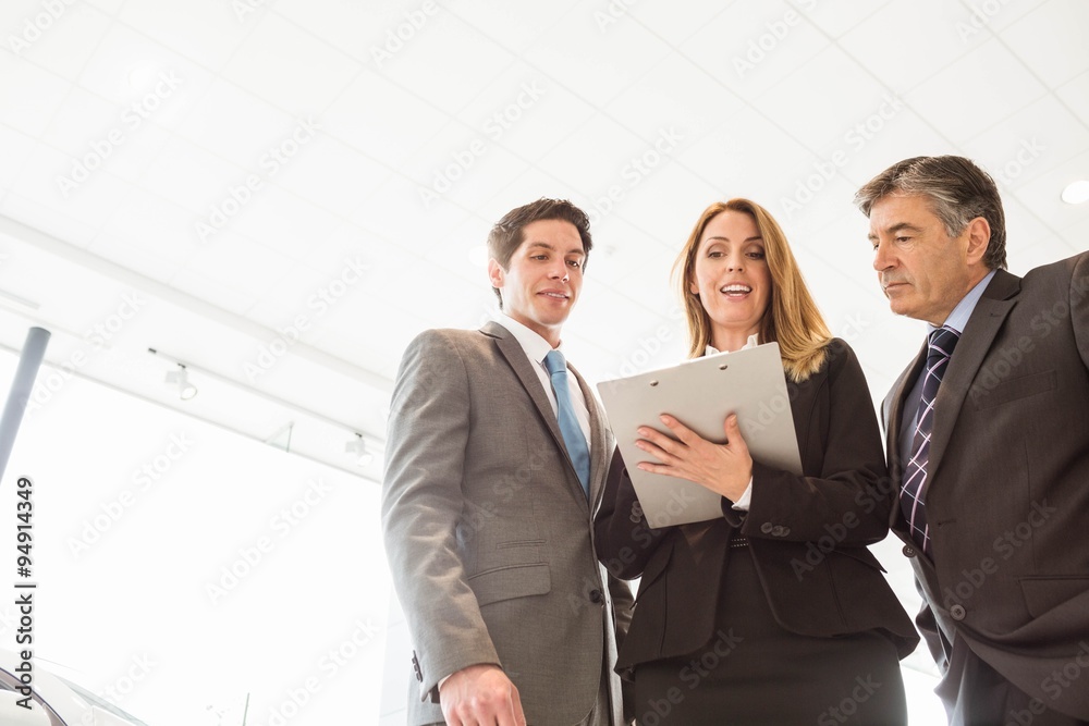 Group of smiling business team standing together Group of smiling business team standing together