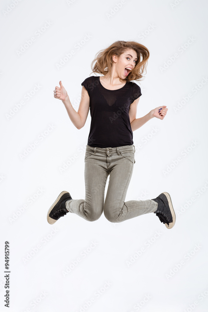 Portrait of a cheerful woman jumping