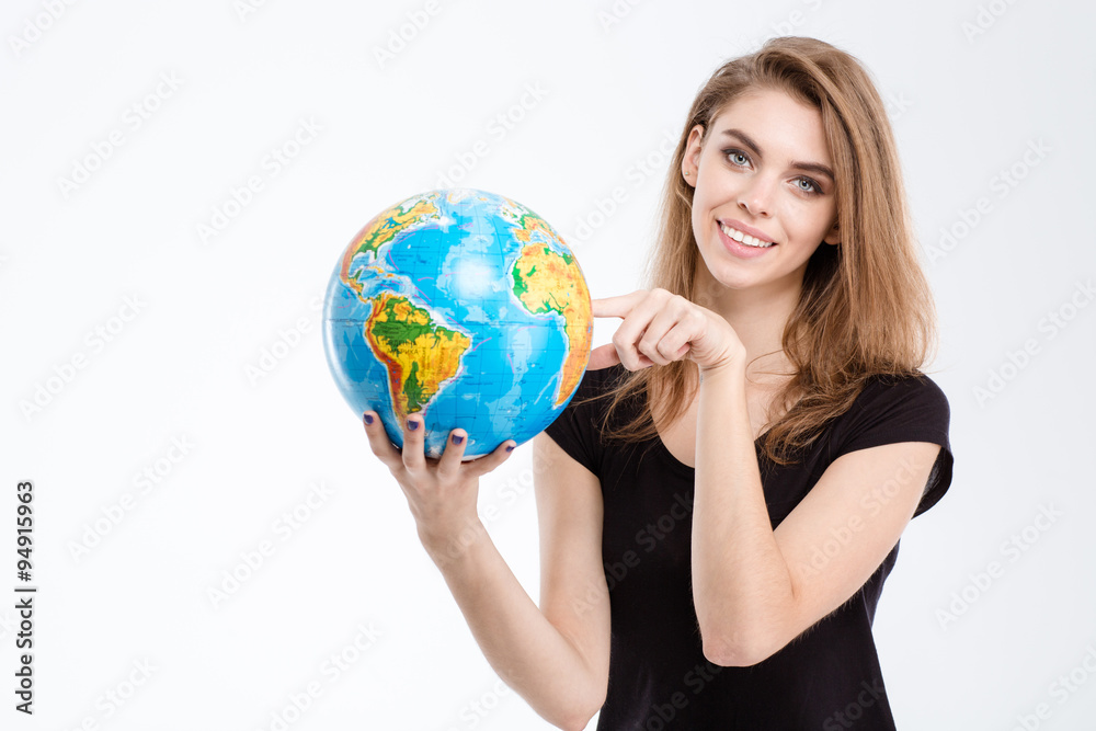 Woman pointing finger on world globe Woman pointing finger on world globe