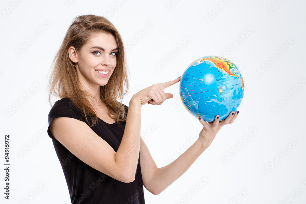 Woman pointing finger on world globe Woman pointing finger on world globe