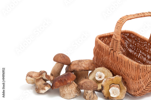 Fresh mushrooms near wicker basket