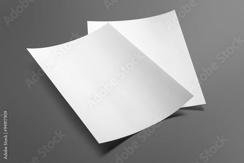 Blank flyer poster isolated on grey to replace your design