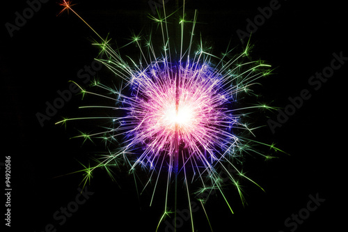 Detail view of a sparkler at night