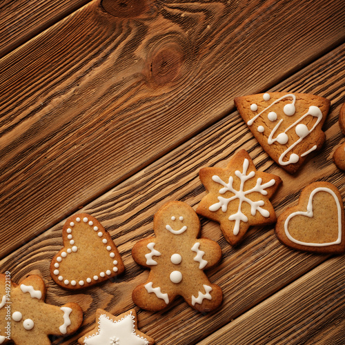 christmas gingerbreads on wooden background