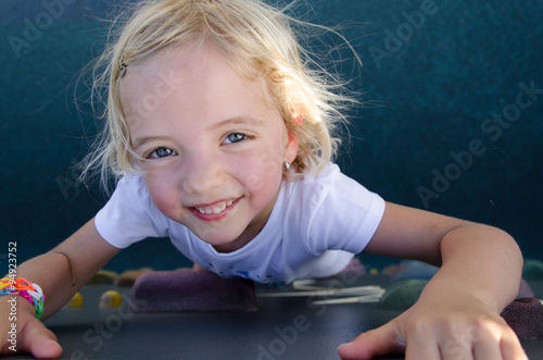 Child on a climbing wall in a park