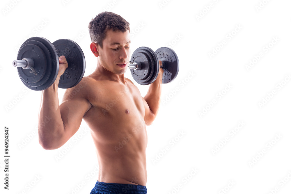 Muscular bodybuilder guy doing exercises