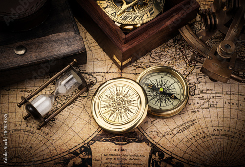Konstfotografi Old compass, astrolabe on vintage map. Retro stale.