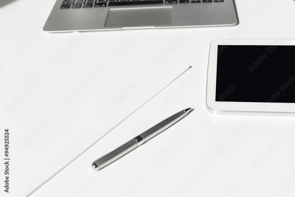 Open laptop with digital tablet and white smartphone Open laptop with digital tablet and white smartphone