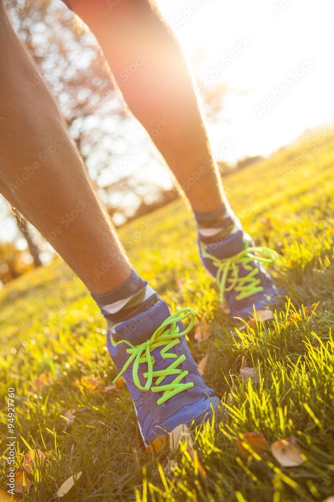 Runner legs outside during autumn day. Runner legs outside during autumn day.