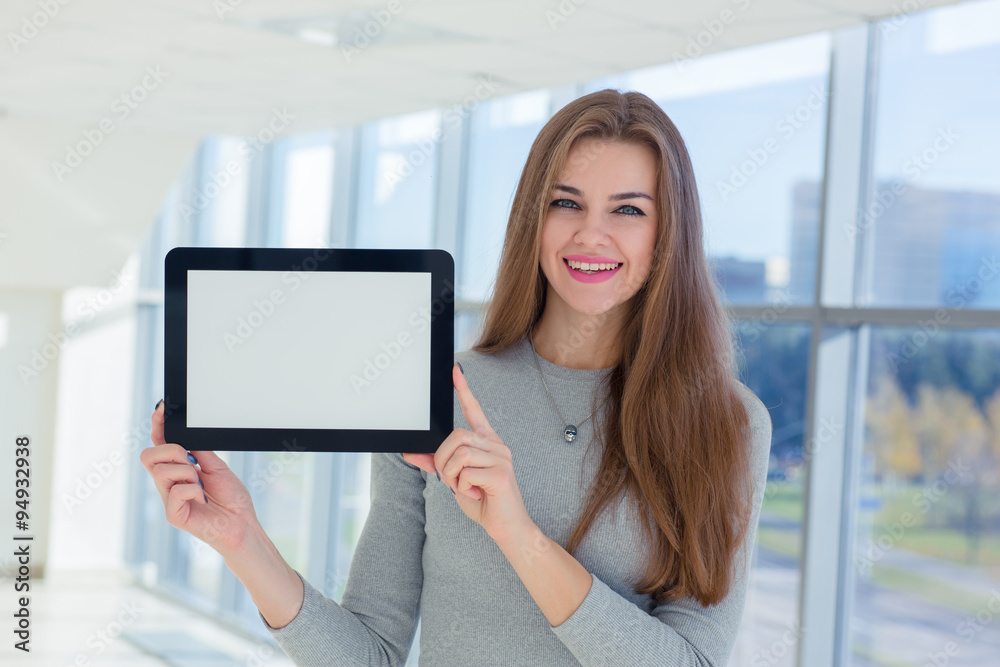 Business woman holding tablet in hand