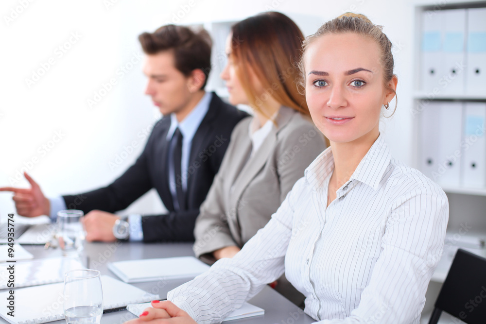 Group of Business people at meeting, focus on blond business woman Group of Business people at meeting, focus on blond business woman