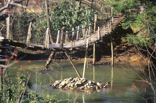 A walking bridge over a creek in West Virginia photo