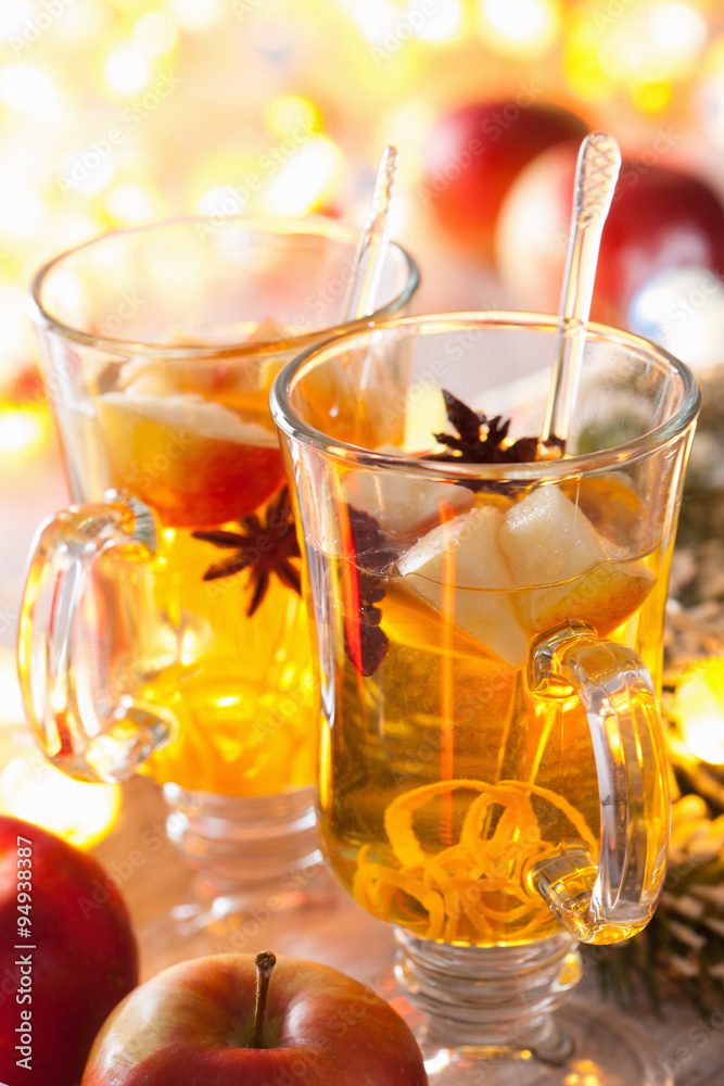 glass of mulled apple cider with orange and spices, winter drink glass of mulled apple cider with orange and spices, winter drink