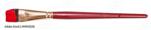 flat artistic paint brush with red painted tip