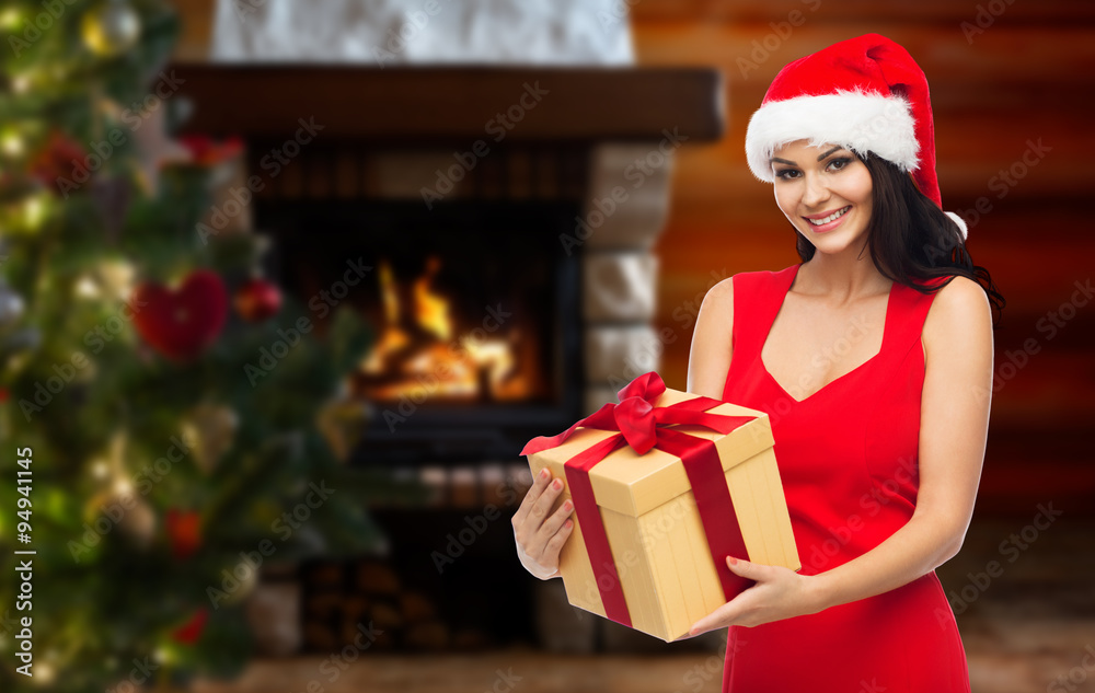 beautiful sexy woman in santa hat with gift box