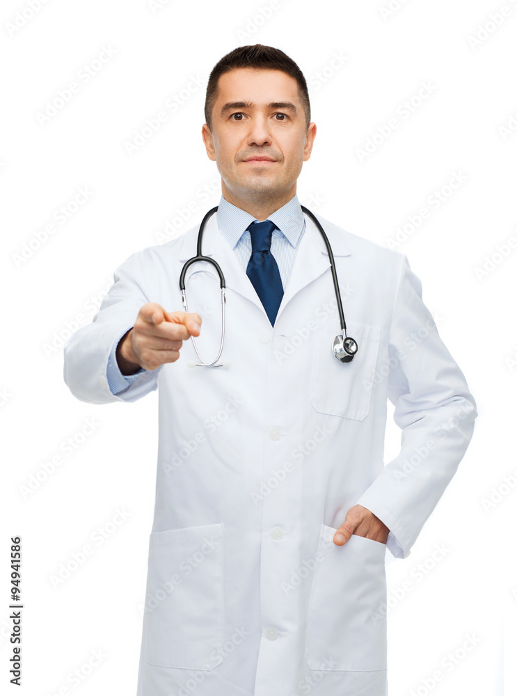 male doctor in white coat pointing at you male doctor in white coat pointing at you