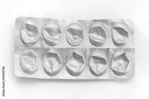 Single blister of medicine used on a white background