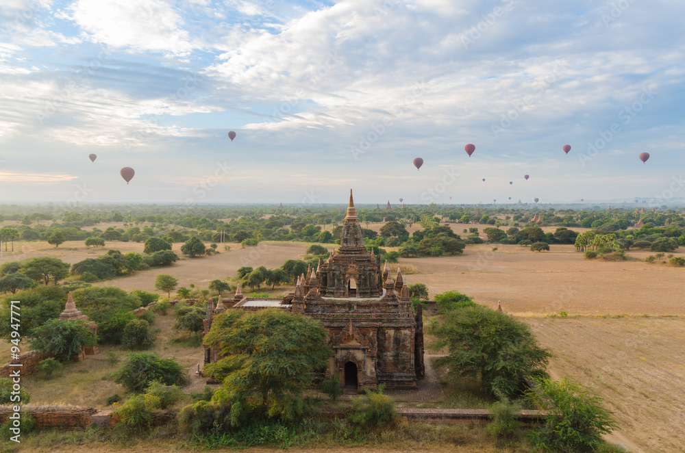 Ancient temple with hot air balloon in Bagan (Pagan) at sunset, Myanmar