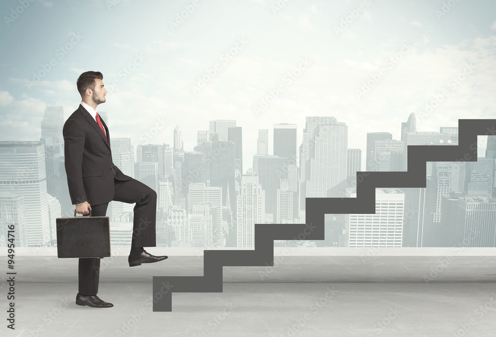 Business person in front of a staircase Business person in front of a staircase