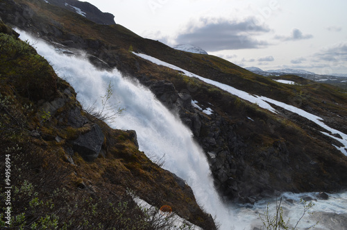 Fototapeta Naklejka Na Ścianę i Meble -  Large waterfall on mountain slope, Swedish subarctic Lapland