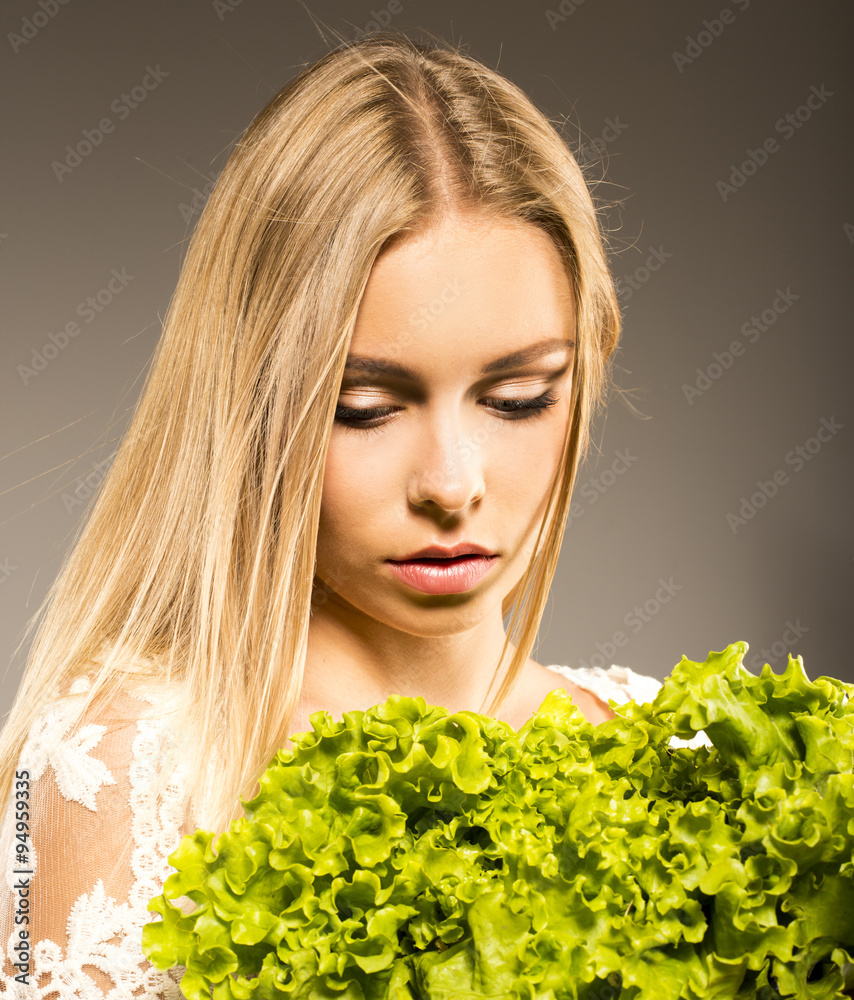 Close-up of pretty girl holding fresh vegetable salad Close-up of pretty girl holding fresh vegetable salad