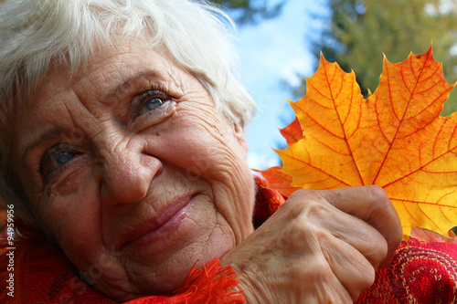 Autumn. happy, elderly woman