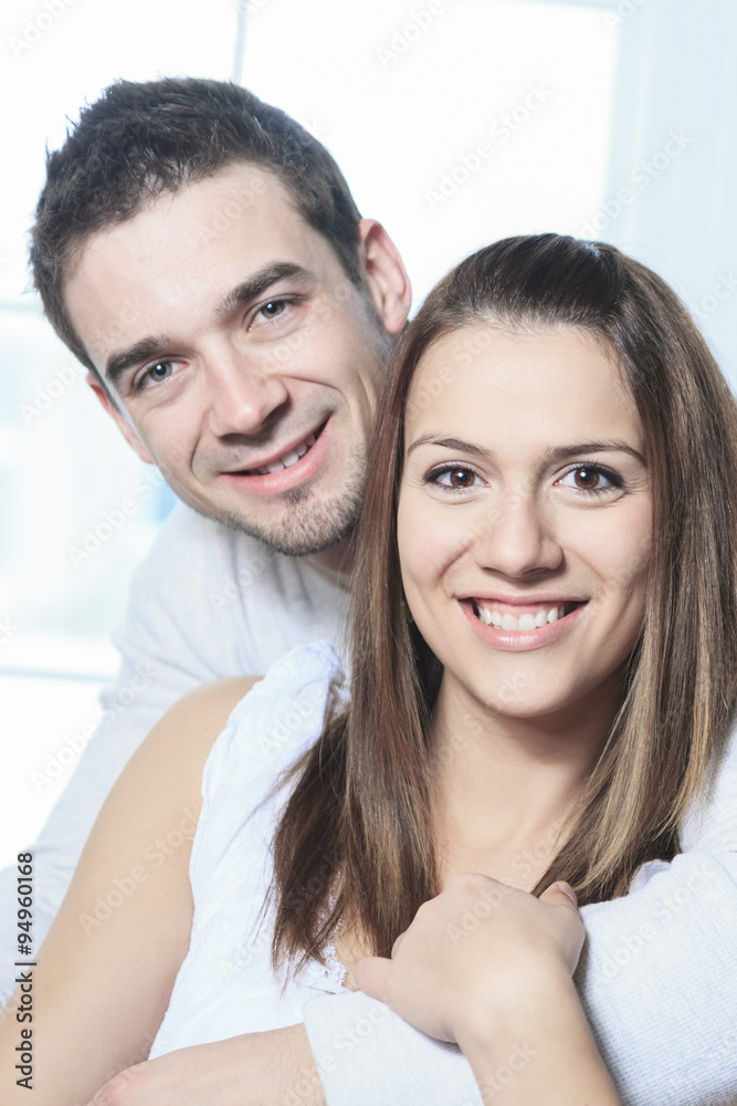 happy couple at home relaxing in sofa happy couple at home relaxing in sofa