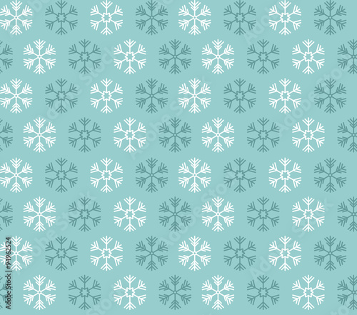 Seamless pattern with blue and white christmas snowflakes on blu