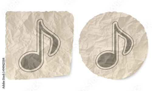 Crumpled slip of paper and a music symbol