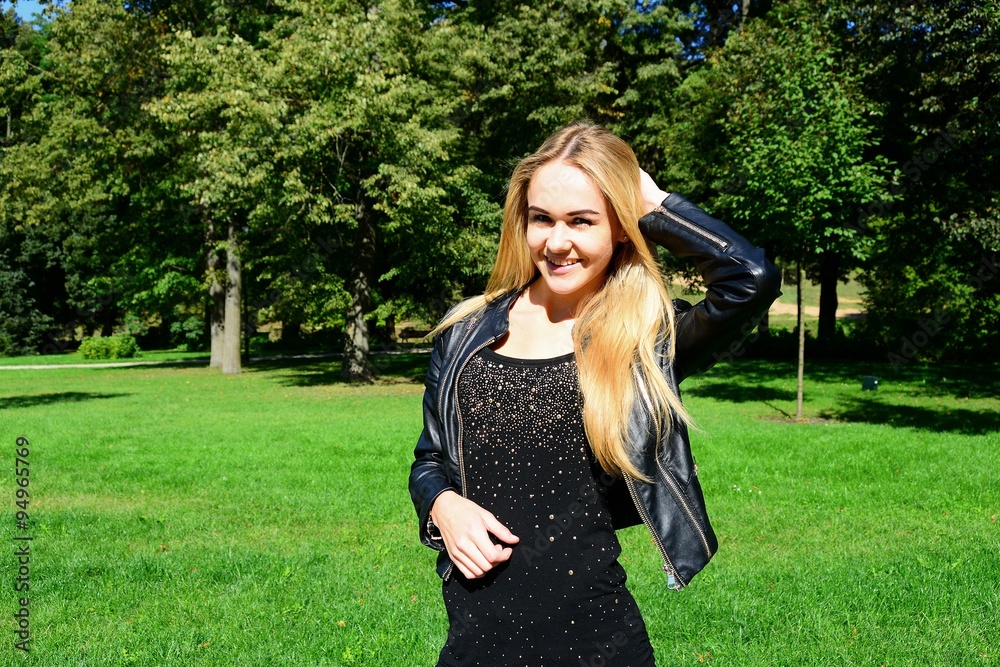 Young girl in Vilnius town Bernardinu garden on autumn
