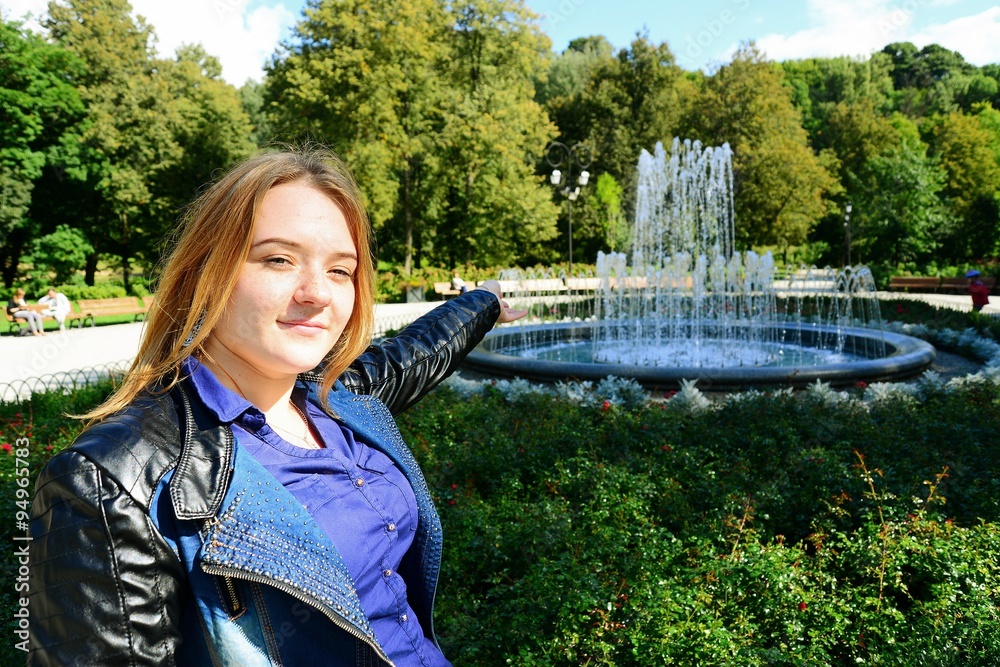 Young girl in Vilnius town Bernardinu garden on autumn