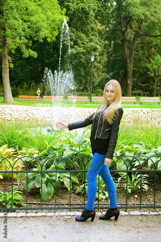 Young girl in Vilnius town Bernardinu garden on autumn