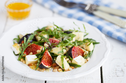 Salad with figs, pine nuts,Camembert Cheese and honey.