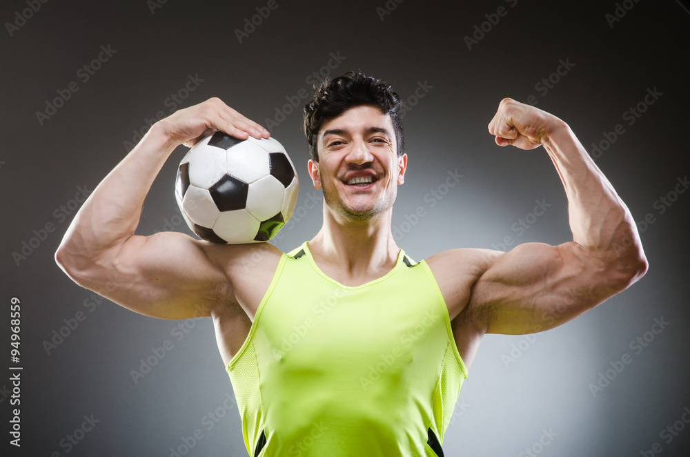 Muscular man with football ball Muscular man with football ball