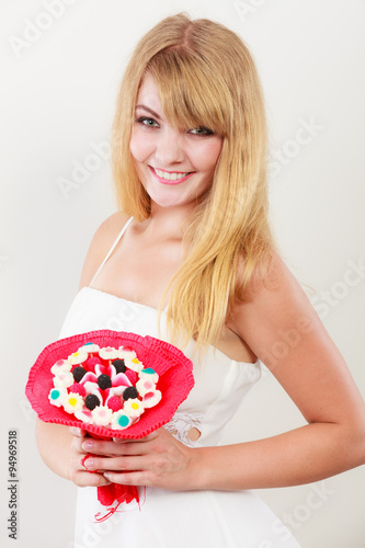 Happy woman with candy bunch flowers.