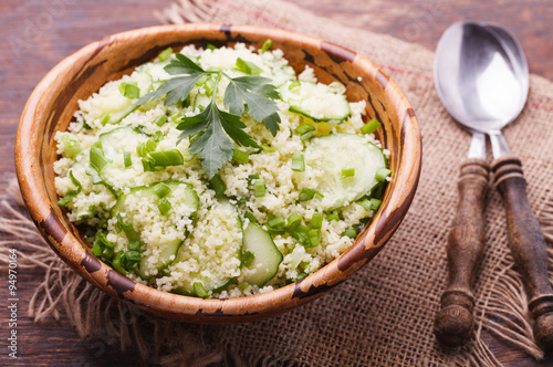 Salad, couscous with cucumber and green onions.selective focus
