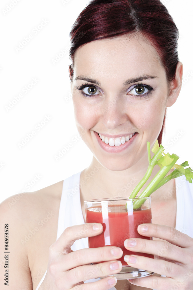 Young female with a glass of tomato juice over white background Young female with a glass of tomato juice over white background