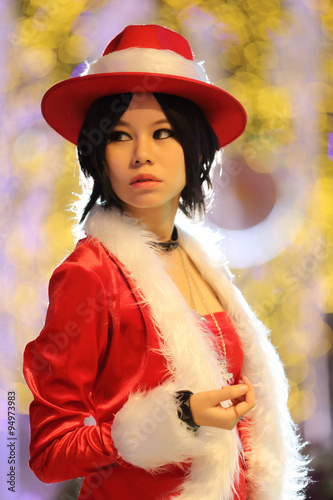 Portrait of beautiful Asian female santa in Christmas