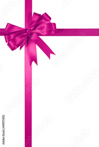 Shocking pink gift ribbon bow border frame isolated on white background for christmas or birthday present decoration photo vertical