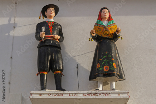 Figuras o esculturas de Maragatos ( Habitantes de la comarca de Astorga en Leon España ) vestidos con el traje típico y tradicional photo