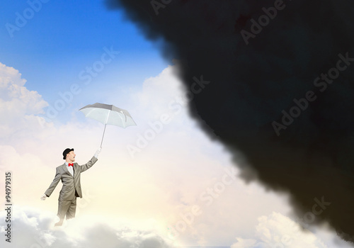 Businessman with colorful umbrella
