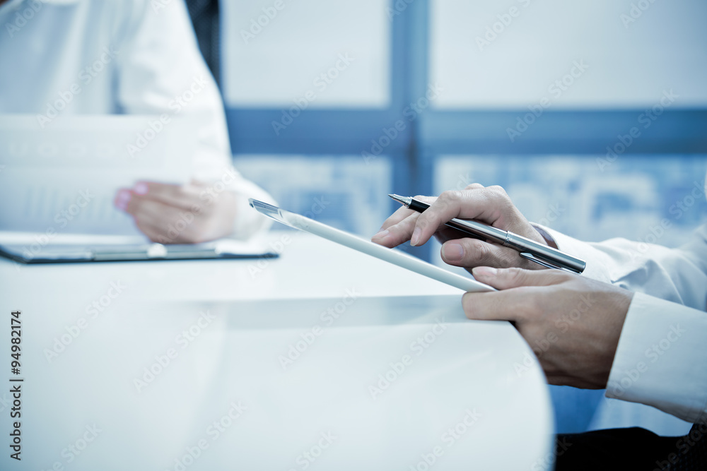 Obraz premium Businessman Using Digital Tablet In Office