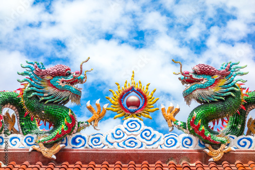 Two dragon on red roof with cloudy blue sky  Chinese temple in T