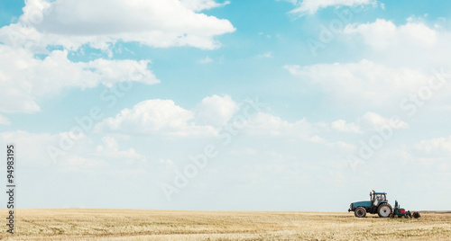 Fotografie Tractor in a field