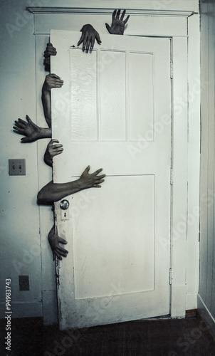 Creepy hands behind door