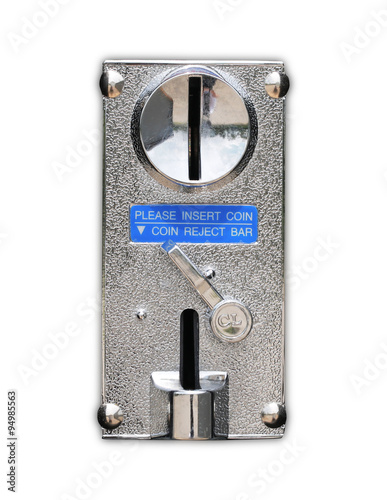 Close up metal coin slot of vending machine.