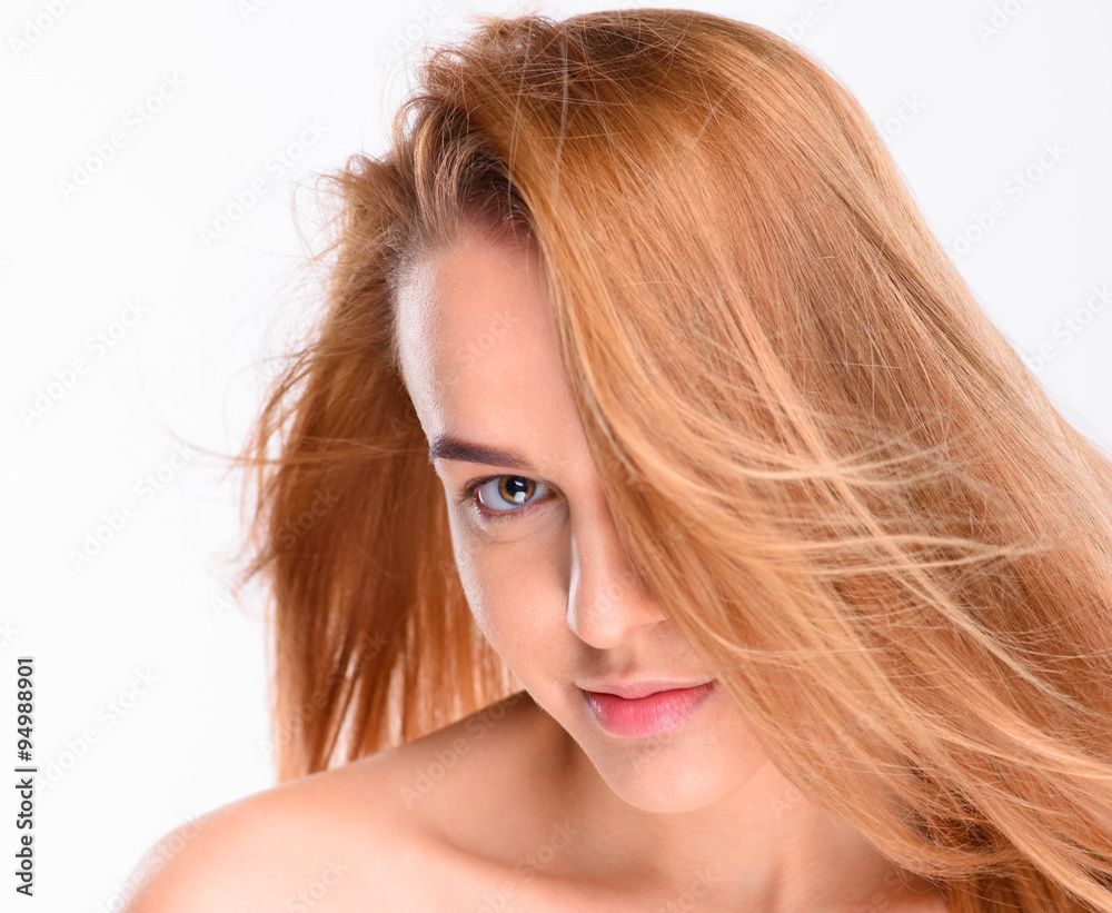Beautiful woman posing and looking at the camera. Isolated on white background Beautiful woman posing and looking at the camera. Isolated on white background