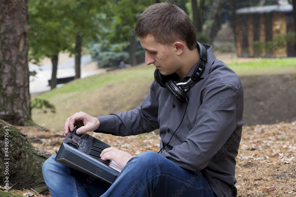 Man playing music outdoors