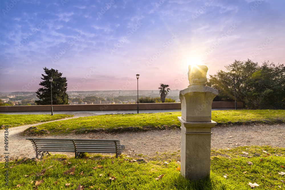 Obraz premium Statue and bench in the Gianicolo park in Rome at sunrise