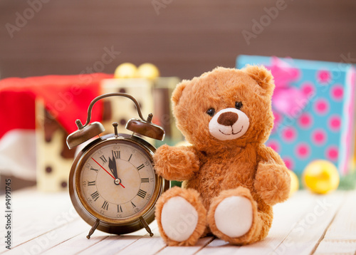 Alarm clock and teddy bear